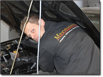 Natanael changing ignition coils on customer car.
